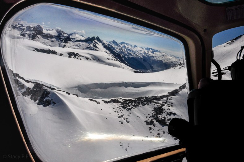 Helicopter Flightseeing; Photo: SPFischer From inside the cockpit of a helicopter, stunnings views of snow-capped mountains, near and far.