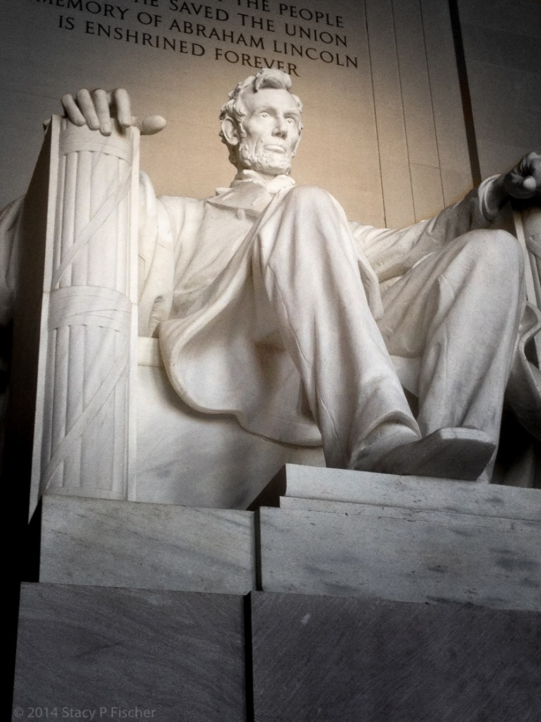 Looking up at the statue, with the end of the epitaph visible above Lincoln's head.
