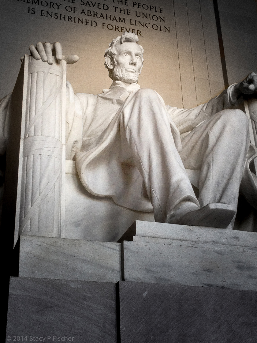 Looking up at the statue, with the end of the epitaph visible above Lincoln's head.