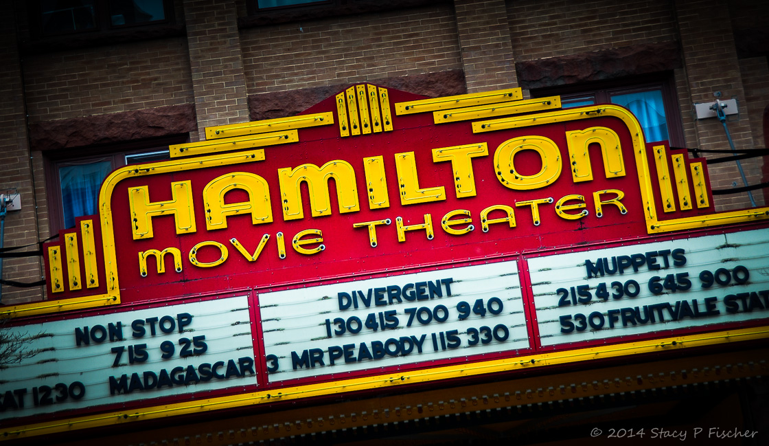 Red and yellow movie marquee in Hamilton, New York.