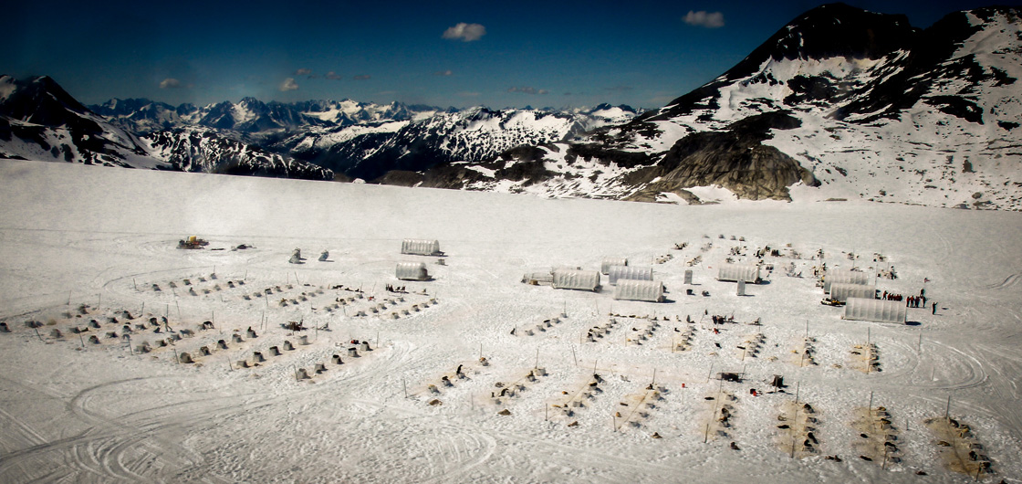 A view from the helicopter window of the musher's camp atop the Denver Glacier.
