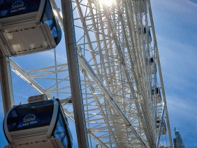 The top half of the Great Wheel, against a bright blue sky.