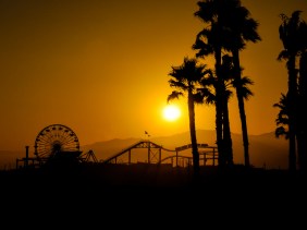 Santa Monica Pier silhouetted against setting sun