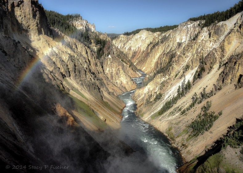Grand Canyon of Yellowstone; Photo: SPFischer Yellowstone River sporting a rainbow in the foreground winds through canyon after tumbling over Lower Falls.