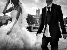 Bride and groom on Ile Saint Louis, Paris, with the River Seine in the background.
