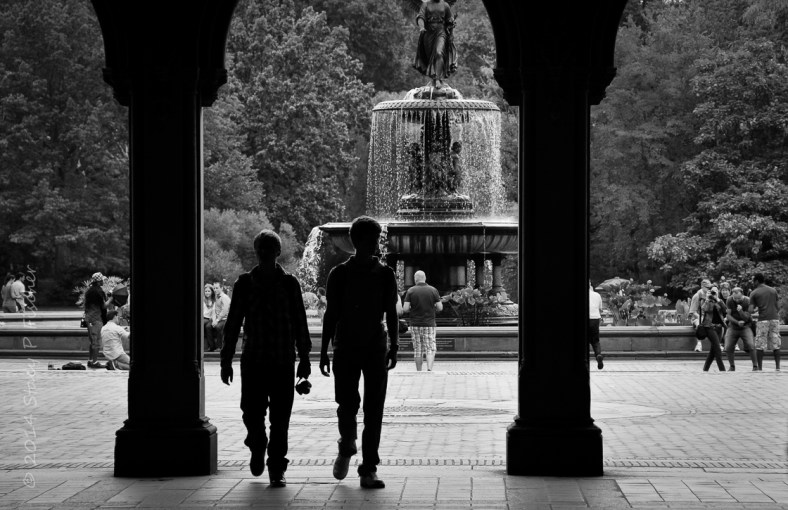 Bethesda Fountain Central Park with silhouetted visitors