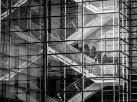 Reflections of escalators on exterior of The Newseum in Washington, DC
