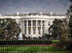 The White House and south lawn viewed through the fence.