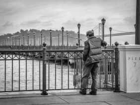 Fisherman at Pier 7 with the backdrop of the Oakland Bay Bridge