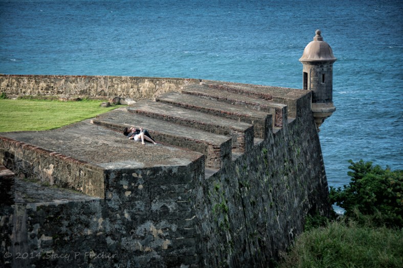 Guerite or sentry box in San Juan with Atlantic Ocean and snuggling couple.