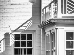 Windows and Shadows cast in the corner exterior of a house