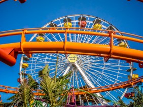 The bright orange track of the West Coaster rollercoaster at Santa Monica's famed Pacific Park.