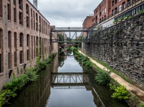 Georgetown, Washington, DC canal looking north toward pedestrian bridges between business buildings