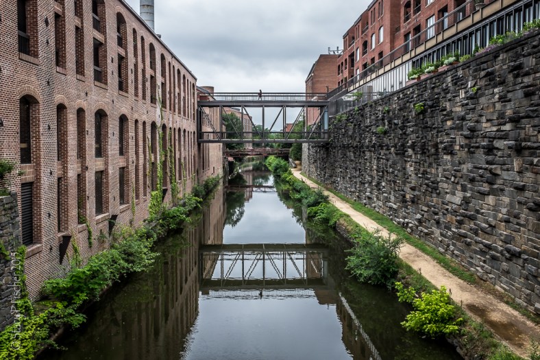 Chesapeake & Ohio (C&O) Canal, Georgetown, Washington, DC, looking north toward pedestrian bridges between business buildings