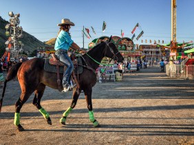 Cowgirl and horse ready for a rodeo at a county fair