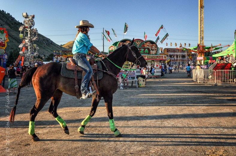 Cowgirl and horse ready for a rodeo at a county fair