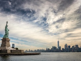 Statue of Liberty overlooking One World Trade Center