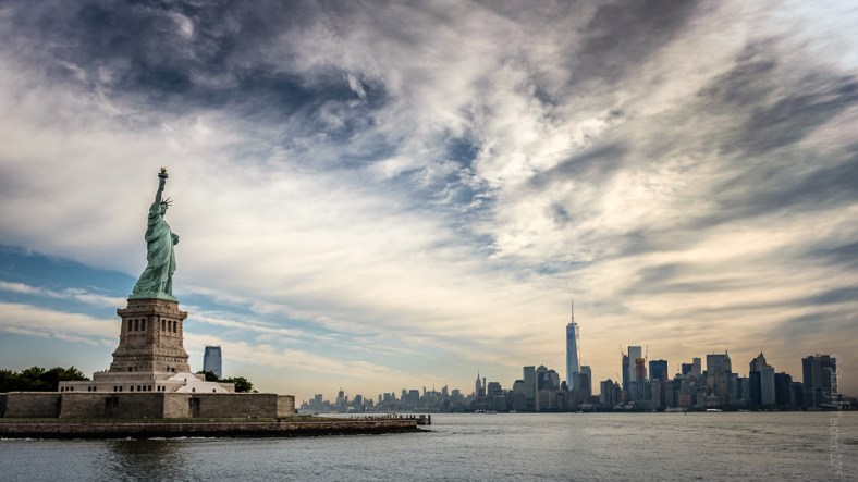 Statue of Liberty overlooking One World Trade Center