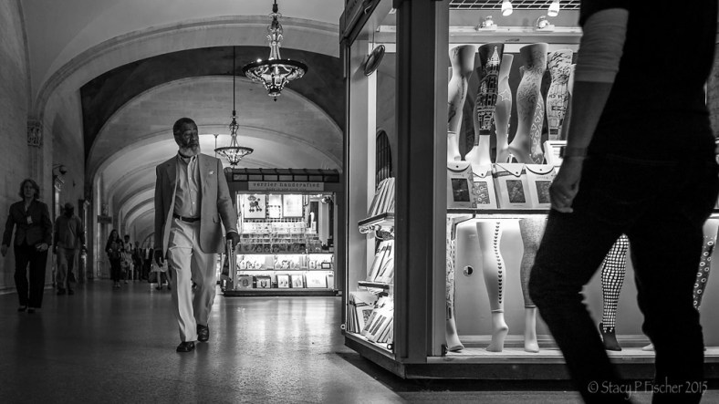 Gentleman eyeing a hosiery display in NYC Grand Central Station kiosk.