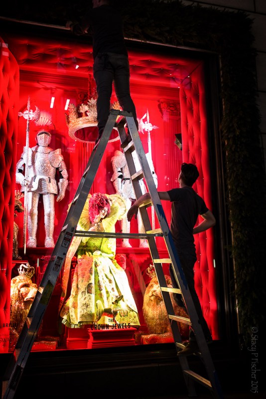 Employees work on unveiling Bergdorf Goodman's 2015 Christmas windows