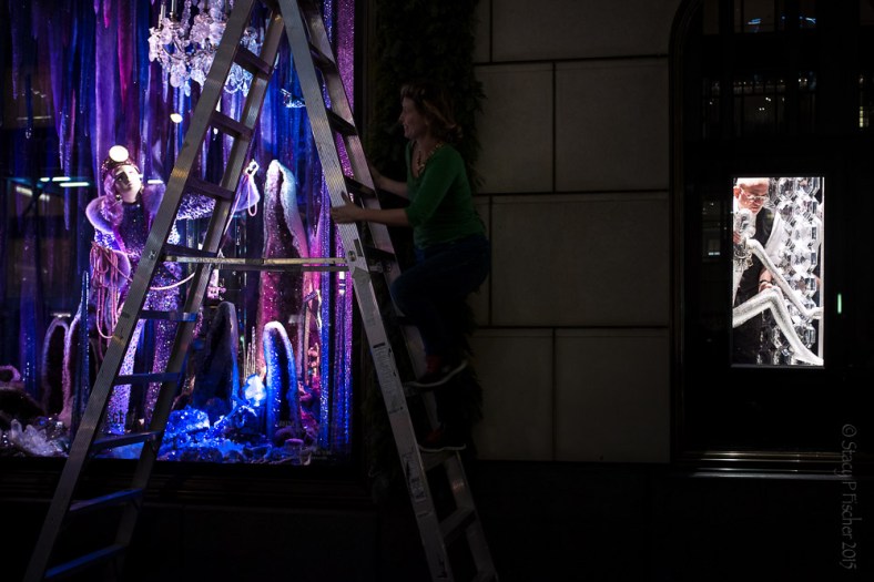 Employees work on unveiling Bergdorf Goodman's 2015 Christmas windows