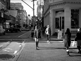 Sidelight illuminates pedestrians in SoHo, New York City