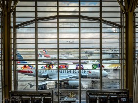 Plane taking off as seen through windows of Terminal C, Ronald Reagan National Airport