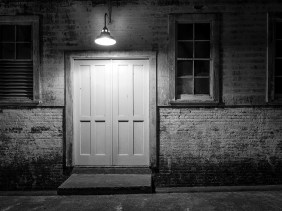 Door at Alcatraz lit at night